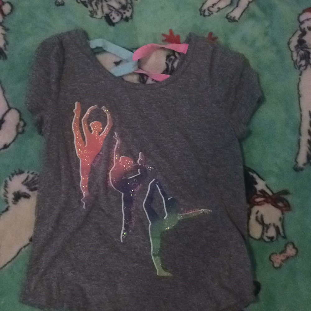A dancing shirt that is gray,purple,pink,and blue.